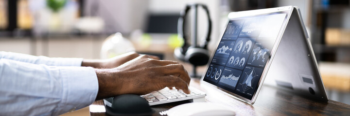 Aufkleber - African Businessman Using Analytics Data KPI Dashboard