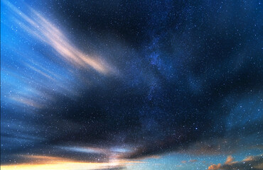Wall Mural -  Beautiful fantastic night sky with long exposure clouds.