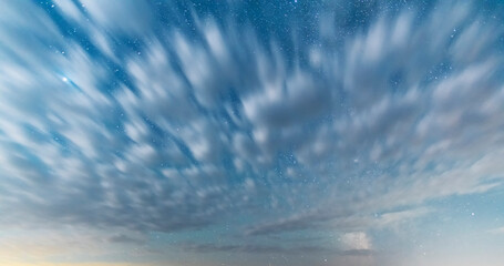 Wall Mural -  Beautiful fantastic night sky with long exposure clouds.