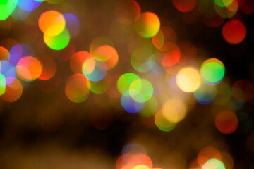 Wall Mural - Multicolored glitter lights background. Blurry rainbow defocused circles. Abstract illuminated backdrop or overlay.