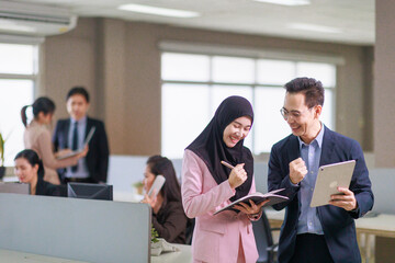 Asian Muslim woman talking with manager in Office. Business and Diversification concept