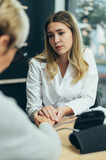 Fototapeta  - Female doctor in consultation with a senior woman patient