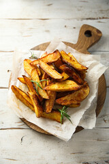 Homemade roasted potato wedges with rosemary