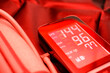 tonometer shows high blood pressure, stroke, heart attack. photographed with red flash