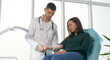 © alex_marina - Planned Preventive Medical Examination of a Young Woman in the Clinic. The Doctor Measures the Blood Pressure of the Patient in the Office of the Clinic. Health Insurance Medical Service Concept.