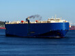 Car carrier underway in harbour departing for next port of call.