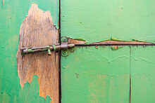 Broken Latch Locking The Decrepit Doors Of The Old Barn