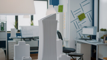 Poster - close up of building model and urban structure on table in empty office. construction maquette used 