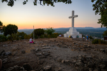 Wall Mural - Medjugorje, Bosnia and Herzegovina. 2021-08-18. The white Cross on the top of Krizevac (Cross Mountain) in Medjugorje. (Words on the cross read: 