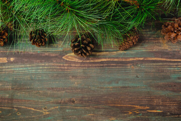 Poster - Christmas pine tree fir with pine cone decoration on vintage rustic wood table background