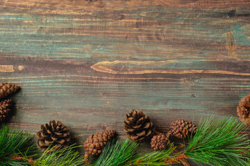 Poster - Christmas pine tree fir with pine cone decoration on vintage rustic wood table background