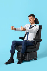 Sticker - Angry young man with imaginary steering wheel in car seat on blue background