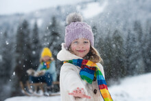 Funny Excited Child Girl Face In Snow On Winter Outdoor. Children In Winter Outdoor In Frost Snowy Day. Amazed Kid Snowball Fight In Park With Winter Background. Expressive Kids Emotions.
