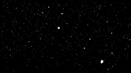 snow falling on black background