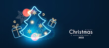 Merry Christmas And Happy New Year Holiday Background With Neon Gift Box, Fir Tree Branch, Bokeh Effect And Lights