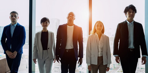 Wall Mural - Group of multi racial people walking in the office. Global business. Teamwork of business. Diversity.