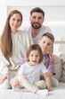 © alotofpeople - Portrait of a happy family smiling at home