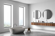 White bathroom interior with bathtub, sinks and mirror, carpet and window