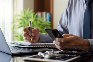 Wall Mural - Doctor using mobile phone