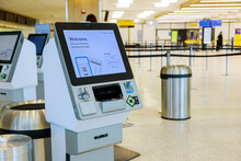 Self Service Machine Desk Kiosk At Airport For Check In Printing Boarding Pass And Buying Ticket