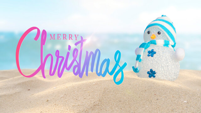 Merry Christmas.Handwriting and Snowman on the sand beach.