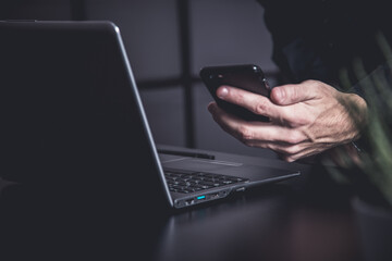 Sticker - Businessman using a smartphone and notebook in a moddy office