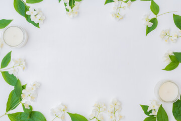 Wall Mural - flat lay composition with jasmine flowers on a white background