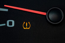 Car Low Tire Pressure Warning Light. Vehicle Repair, Maintenance, And Cold Weather Safety Concept.