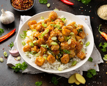 General Tso Tofu With Rice, Green Onion And Pak Choi. Asian Vegan Food