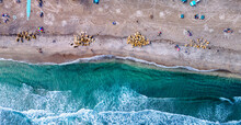 Downward Drone Shot Of Waves Crashing On Beach 