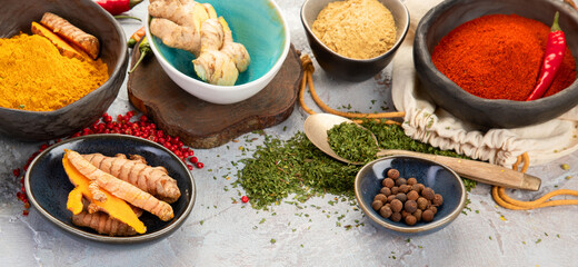 Poster - Assortment of Indian spices on gray background.