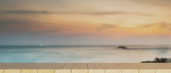 Wall Mural - Wooden tabletop or board over beautiful ocean sky view in the background.