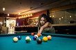 © RomanR - beautiful brunette about to shoot snooker