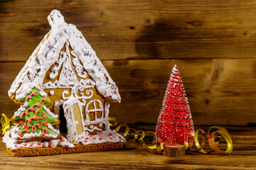 Wall Mural - Christmas Gingerbread house on a wooden table