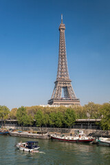 Fototapete - Paris with Eiffel Tower against boats during spring time in France