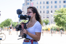 Young Woman On Camera With Gimbal