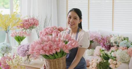 Wall Mural - Asia people young woman SME owner happy smile look at camera greeting enjoy open flower shop work at home office workspace. Loan money banking for online store seller. Girl power pride in sale order.