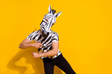 Canvas Print - Photo of creative cheerful guy dressed wild animal costume dancing empty space isolated yellow color background