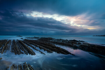 Wall Mural - itzurun beach in zumaia with the famous flysch coast in the basque country