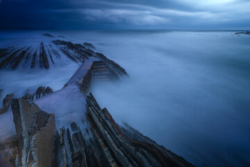 Wall Mural - itzurun beach in zumaia with the famous flysch coast in the basque country