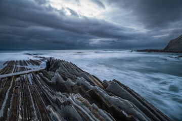 Wall Mural - itzurun beach in zumaia with the famous flysch coast in the basque country