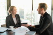 © u photostock - Two businessman and businesswoman couple meeting in co working space or office