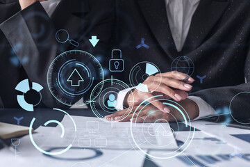 Two information technology specialist brainstorming on project to create a new approach to develop software to improve business service. Technological icons over the table with document.