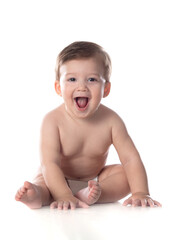 Wall Mural - Healthy baby boy sitting on a white isolated