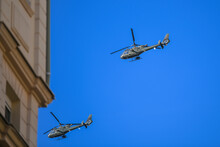 Two Military Helicopters Flying In Formation In City, Between Buildings. Demonstration Of The Qualities Of A Helicopter And Serbian Airforce In Fight.