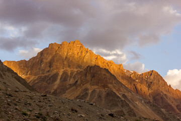 Wall Mural - Evening light hitting the barren brown mountains of the Zanskar range in the Himalayan region of Ladakh.