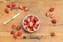 Fresh Ripe Strawberries Lying On Wooden Surface