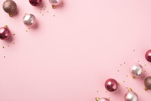 Top View Photo Of Pink Christmas Tree Decorations Balls And Gold Sequins On Isolated Pastel Pink Background With Copyspace