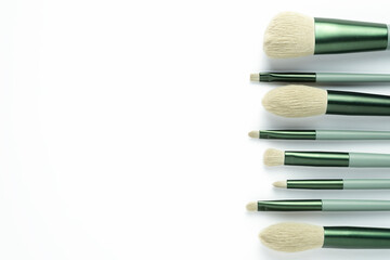 Wall Mural - Makeup brushes on white background. Top view, copy space