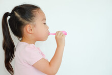 Little Asia Child Girl Blowing Balloon
